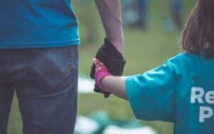 photo of child holding hand