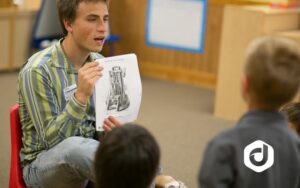 photo young man teaching children