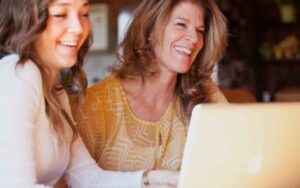 photo of two adult women smiling