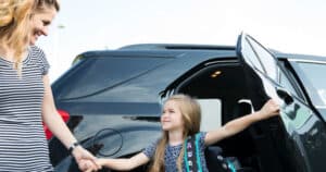 photo of child at car door