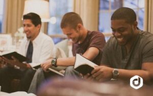 photo of young men laughing and reading